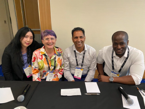 4 people smiling